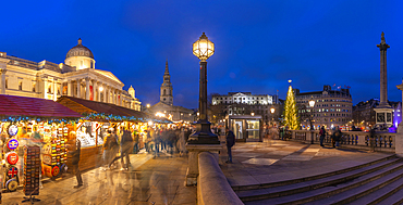 View of Christmas market and The National Gallery in Trafalgar Square at dusk, Westminster, London, England, United Kingdom, Europe