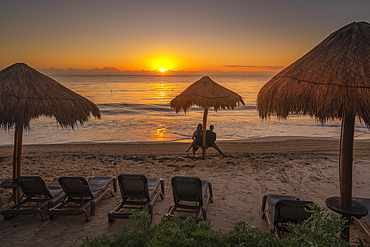 View of couple at sunrise and beach near Puerto Morelos, Caribbean Coast, Yucatan Peninsula, Mexico, North America