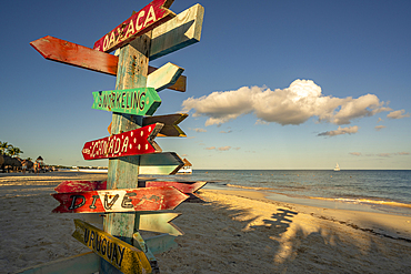 View of destination signpost near Puerto Morelos, Caribbean Coast, Yucatan Peninsula, Mexico, North America