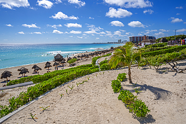 View of long white sandy beach at Playa Delfines, Hotel Zone, Cancun, Caribbean Coast, Yucatan Peninsula, Mexico, North America