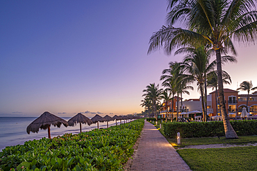 View of hotel and beach at dusk near Puerto Morelos, Quintana Roo, Caribbean Coast, Yucatan Peninsula, Riviera Maya, Mexico, North America