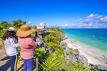 View of tourists and Mayan Temple ruins overlooking the sea, Tulum, Quintana Roo, Caribbean Coast, Yucatan Peninsula, Riviera Maya, Mexico, North America