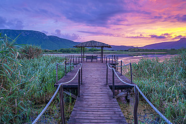 View of Jet lake and Ubombo Mountain from Ghost Mountain Inn at sunrise, Mkuze, KwaZulu-Natal Province, South Africa, Africa