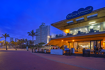 View of promenade restaurant and hotels from New Pier at dusk, Durban, KwaZulu-Natal Province, South Africa, Africa