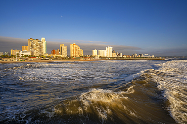 View of promenade, beach and hotels from pier in Indian Ocean at sunrise, Durban, KwaZulu-Natal Province, South Africa, Africa