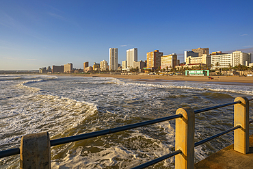 View of promenade, beach and hotels from pier in Indian Ocean at sunrise, Durban, KwaZulu-Natal Province, South Africa, Africa