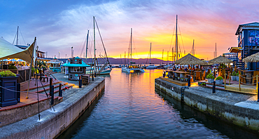 View of golden sunset, boats and restaurants at Knysna Waterfront, Knysna, Western Cape Province, South Africa, Africa