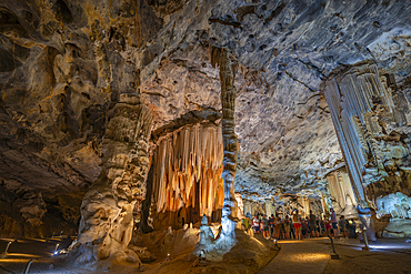 View of visitors viewing stalagmites and stalactites in the interior of Cango Caves, Oudtshoorn, Western Cape, South Africa, Africa