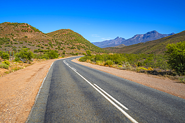 View of road R62 and green mountainous landscape between Zoar and Calitzdorp, South Africa, Africa