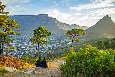 View of couple and Table Mountain from Signal Hill at sunset, Cape Town, Western Cape, South Africa, Africa