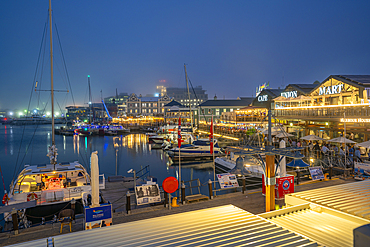 View of boats and restaurants in the Waterfront at dusk, Cape Town, Western Cape, South Africa, Africa