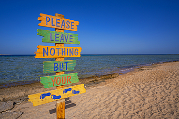 View of  sign reading Please Leave Nothing But Your Footprints on the Beach, Sahl Hasheesh, Hurghada, Red Sea Governorate, Egypt, North Africa, Africa