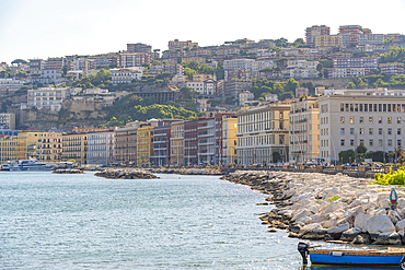 View of pastel coloured architecture on waterfront of Via Francesco Caracciolo, Naples, Campania, Italy, Europe