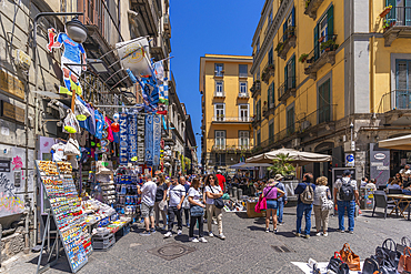 View of shop and architecture on bustling Piazzetta Nilo, Naples, Campania, Italy, Europe