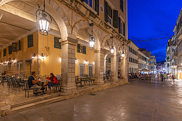 View of restaurant on Nikiforou Theotoki at dusk, Corfu Town, Corfu, Ionian Sea, Greek Islands, Greece, Europe