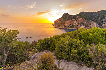 View of coastline from Monastery of Paleokastritsa at sunset, Palaiokastritsa, Corfu, Ionian Sea, Greek Islands, Greece, Europe