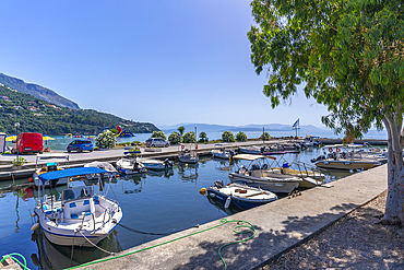 View of harbour boats in Saint Mark Pier at Ipsos, Ipsos, Corfu, Ionian Sea, Greek Islands, Greece, Europe