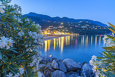 View of Ionian Sea and Ipsos Beach in Ipsos at dusk, Ipsos, Corfu, Ionian Sea, Greek Islands, Greece, Europe