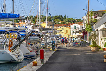 View of boats and cafes in the harbour in Gaios Town, Paxos, Ionian Sea, Greek Islands, Greece, Europe