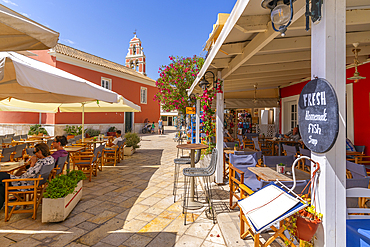 View of cafes and restaurants in Gaios Plaza de l'Ascension in Gaios Town, Paxos, Ionian Sea, Greek Islands, Greece, Europe