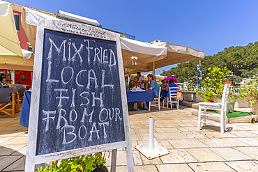 View of local restaurant board in Gaios Town, Paxos, Ionian Sea, Greek Islands, Greece, Europe