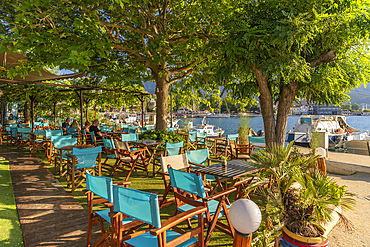 View of restaurant, boats and harbour in Thassos Town, Thassos, Aegean Sea, Greek Islands, Greece, Europe