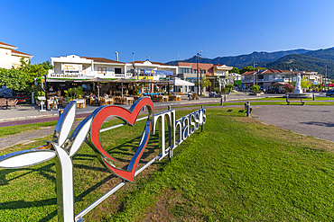 View of tavervas and I Love Thassos sign in the port of Thassos Town, Thassos, Aegean Sea, Greek Islands, Greece, Europe