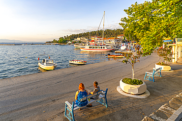 View of boats in old harbour in Thassos Town during golden hour, Thassos, Aegean Sea, Greek Islands, Greece, Europe