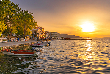 View of boats in old harbour in Thassos Town during golden hour, Thassos, Aegean Sea, Greek Islands, Greece, Europe