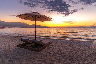 View of sun lounger on the beach and Aegean Sea after sunset, Thassos Town, Thassos, Aegean Sea, Greek Islands, Greece, Europe