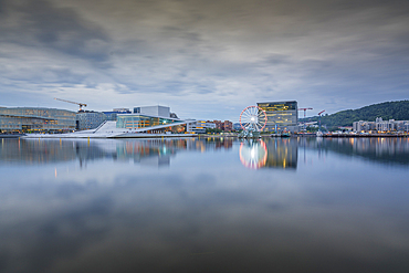 View of Oslo Opera House and Munch Museum reflecting in harbour on cloudy day, Oslo, Norway, Scandinavia, Europe