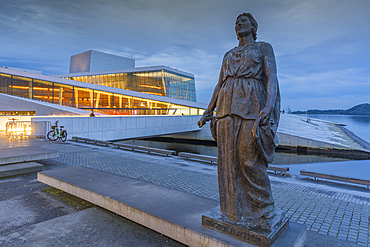 View of Kirsten Flagstad statue and Oslo Opera House reflecting in harbour on cloudy evening, Oslo, Norway, Scandinavia, Europe