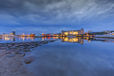 View of buildings reflecting in harbour at dusk, Oslo, Norway, Scandinavia, Europe