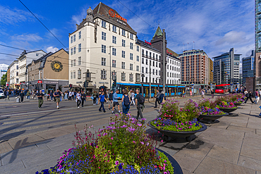 View of summer flowers and architecture in Jernbanetorget, Oslo, Norway, Scandinavia, Europe