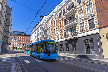 View of architecture and city tram on Dokkveien, Aker Brygge, Oslo, Norway, Scandinavia, Europe