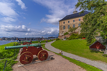 View of the Akershus Fortress, cannons and city skyline from inside the walls on a sunny day, Oslo, Norway, Scandinavia, Europe