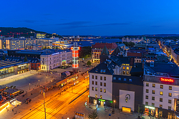 View of Jernbanetorget and city skyline from elevated position at dusk, Oslo, Norway, Scandinavia, Europe