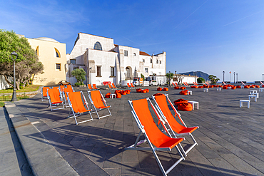 View of town hall and brightly coloured deckchairs, Forio, Island of Ischia, Campania, Italy, Europe