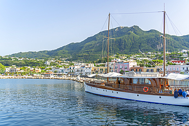 View of sailboat and town of Lacco Ameno, Island of Ischia, Campania, Italy, Europe