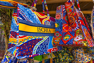 View of colourful bags in shop near Aragonese Castle, Port of Ischia, Island of Ischia, Campania, Italy, Europe