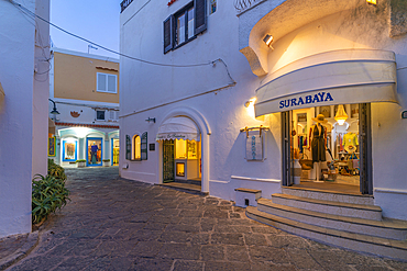 View of shops in Porto di Sant'Angelo at dusk, Sant'Angelo, Island of Ischia, Campania, Italy, Europe