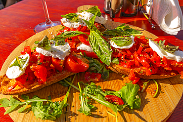 View of Italian Bruschetta at restaurant in Porto d'Ischia (Port of Ischia), Island of Ischia, Campania, Italy, Europe