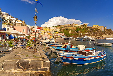 View of restaurants and fishing boats in Marina di Corricella, Procida, Phlegraean Islands, Gulf of Naples, Campania, Southern Italy, Italy, Europe