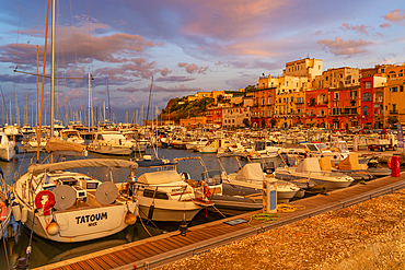 View of the fishing port Marina Grande with boats at golden hour, Procida, Phlegraean Islands, Gulf of Naples, Campania, Southern Italy, Italy, Europe