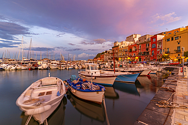 View of the fishing port Marina Grande with boats at golden hour, Procida, Phlegraean Islands, Gulf of Naples, Campania, Southern Italy, Italy, Europe