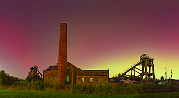 View of Northern Lights (Aurora borealis) and Pleasley Colliery Headstocks, Bolsover, Derbyshire, England, United Kingdom, Europe