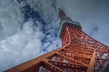 View of Tokyo Tower from its base against cloudy sky, Shibakoen, Minato City, Tokyo, Honshu, Japan