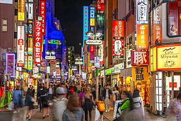 View of busy street and neon lights at night in Shibuya District, Kamiyamacho, Shibuya City, Tokyo, Japan, Asia