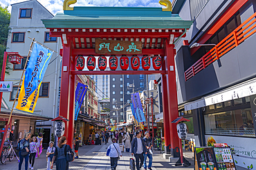 View of Torii gate, colourful shops and buildings in Asakusa, Taito City, Tokyo, Japan, Asia