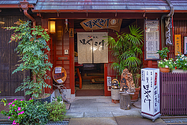 View of entrance to traditional dark wood restaurant in the Higashi Chaya District, Kanazawa City, Ishikawa Prefecture, Honshu, Japan, Asia